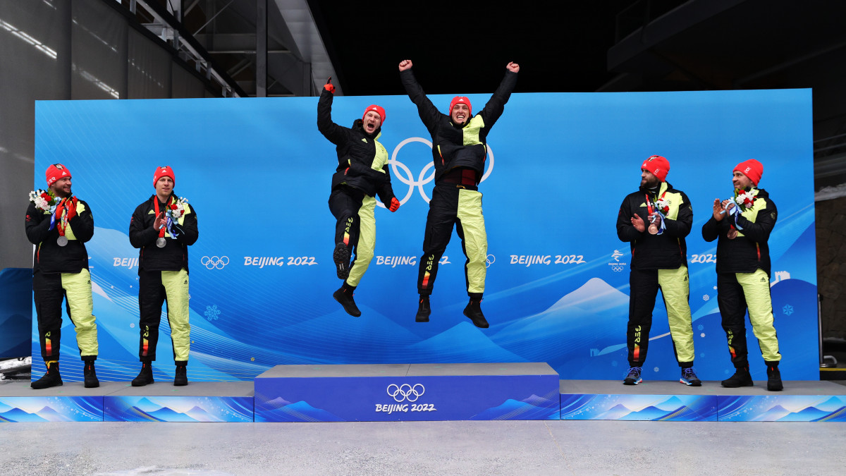 YANQING, CHINA - FEBRUARY 15:  Gold medallists Francesco Friedrich and Thorsten Margis of Team Germany celebrate during the 2-man Bobsleigh medal ceremony on day 11 of Beijing 2022 Winter Olympic Games at National Sliding Centre on February 15, 2022 in Yanqing, China. (Photo by Julian Finney/Getty Images)