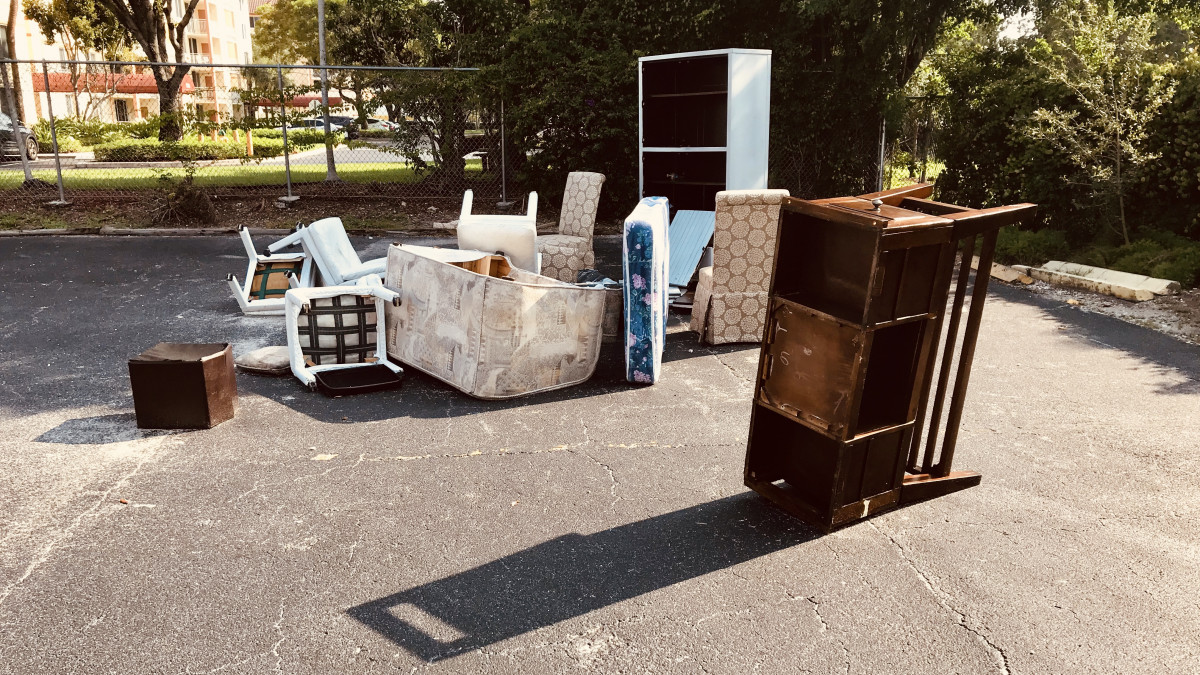old broken furnitures thrown at side of street in Florida