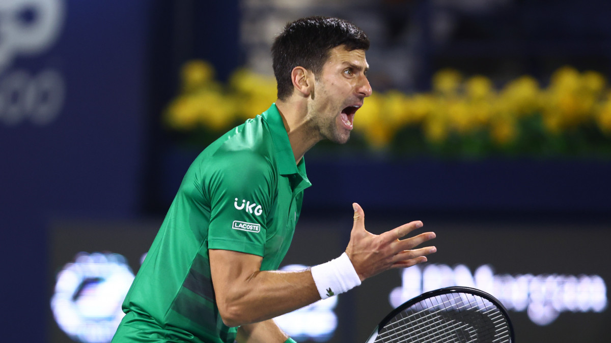 DUBAI, UNITED ARAB EMIRATES - FEBRUARY 21: Novak Djokovic of Serbia reacts during his Mens singles match against Lorenzo Musetti of Italy on day eight of the Dubai Duty Free Tennis at Dubai Duty Free Tennis Stadium on February 21, 2022 in Dubai, United Arab Emirates. (Photo by Francois Nel/Getty Images)