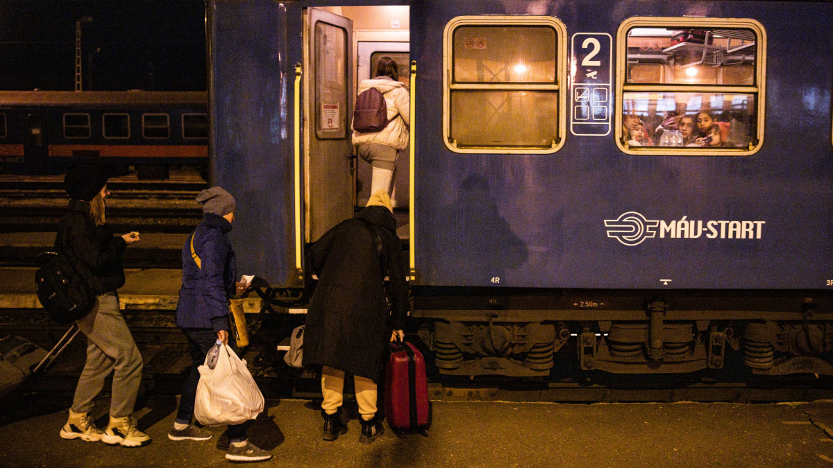 Displaced Ukrainians take a night train to Debrecen, Hungary, from Zahony, Hungary, on Sunday, Feb. 27, 2022. United Nations agencies forecast as many as 4 million refugees will flee Ukraine to neighbouring countries if the Russian invasion continues. Photographer: Akos Stiller/Bloomberg via Getty Images
