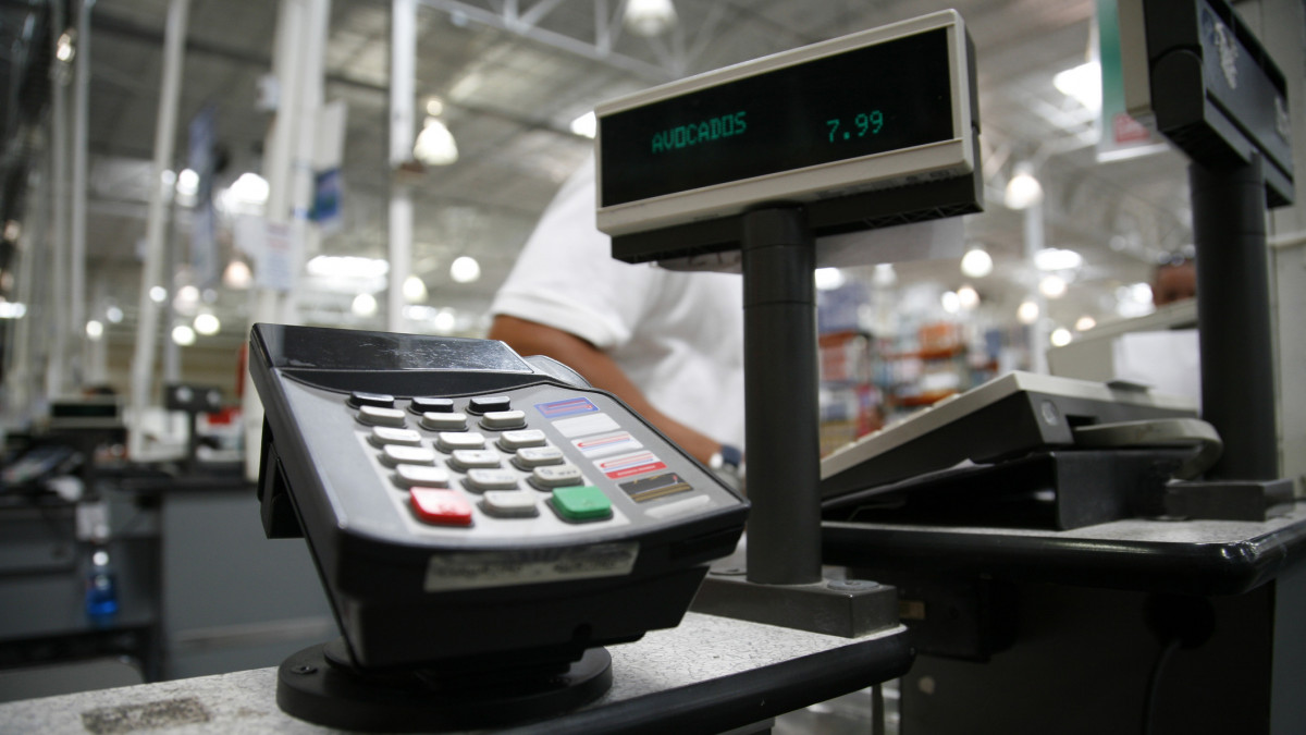 Credit card terminal at large store at the cashier station.