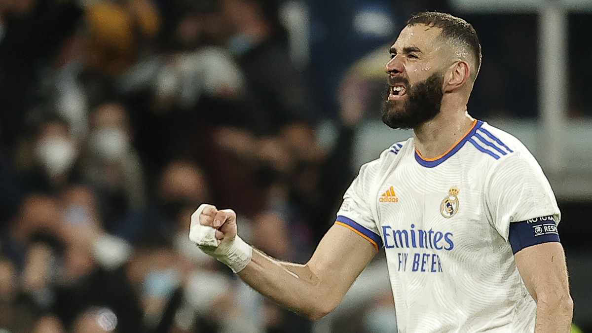 MADRID, SPAIN - MARCH 9: Karim Benzema (9) of Real Madrid celebrates after scoring a goal during the UEFA Champions League round of sixteen leg two match between Real Madrid and Paris Saint-Germain at Estadio Santiago Bernabeu on March 09, 2022 in Madrid, Spain. (Photo by Burak Akbulut/Anadolu Agency via Getty Images)