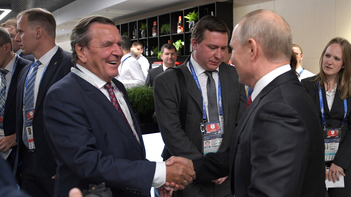 MOSCOW, RUSSIA - JUNE 14:  President Vladimir Putin, Gerhard Schroeder, Chairman of the Shareholders Committee with Nord Stream 2 AG and former German chancellor, attend the Presidents Lounge during during the opening ceremony prior to the 2018 FIFA World Cup Russia Group A match between Russia and Saudi Arabia at Luzhniki Stadium on June 14, 2018 in Moscow, Russia.  (Photo by Pool/Getty Images)