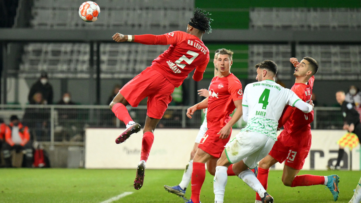 FUERTH, GERMANY - MARCH 13: Mohamed Simakan of RB Leipzig scores their teams fifth goal during the Bundesliga match between SpVgg Greuther FĂźrth and RB Leipzig at Sportpark Ronhof Thomas Sommer on March 13, 2022 in Fuerth, Germany. (Photo by Sebastian Widmann/Getty Images)