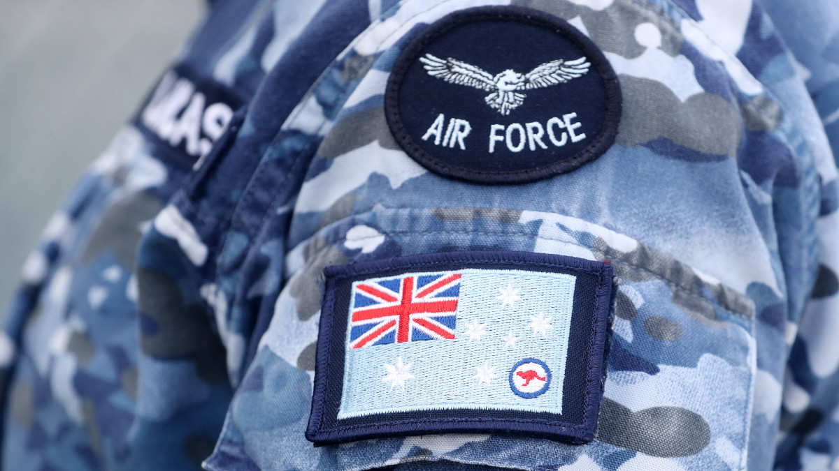 ADELAIDE, AUSTRALIA - JANUARY 31: Detail of an Australian Air Force badge on the uniform of an aircraft crew member on January 31, 2022 in Adelaide, Australia. The defence force will deliver food and supplies to the town of Coober Pedy in South Australia after floods damaged rail infrastructure and cut supply lines to the Northern Territory and Western Australia. (Photo by Sarah Reed/Getty Images)