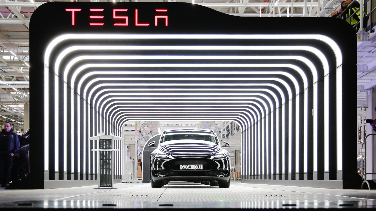 GRUENHEIDE, GERMANY - MARCH 22: A new Tesla car is seen during the official opening of the new Tesla electric car manufacturing plant on March 22, 2022 near Gruenheide, Germany. The new plant, officially called the Gigafactory Berlin-Brandenburg, is producing the Model Y as well as electric car batteries. (Photo by Christian Marquardt - Pool/Getty Images)