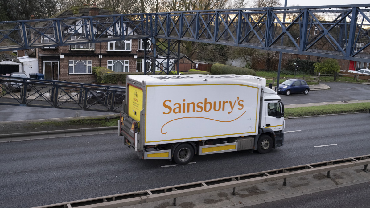 Sainsburys delivery truck passes along the A40 Western Avenue with residential houses either side at Greenford on 4th December 2020 in London, United Kingdom. The A40 is one of the main roads in and out of the capital. (photo by Mike Kemp/In Pictures via Getty Images)