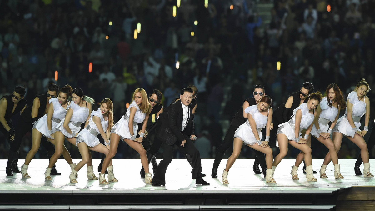 INCHEON, SOUTH KOREA - SEPTEMBER 19:  (CHINA OUT) South Korean singer Psy, Park Jae-sang, performs during the opening ceremony of the 17th Asian Games at the Incheon Asiad Main Stadium on September 19, 2014 in Incheon, South Korea.  (Photo by Visual China Group via Getty Images/Visual China Group via Getty Images)