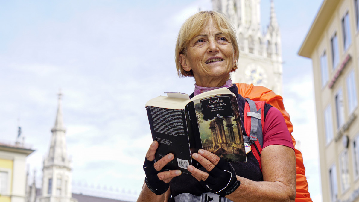 Vienna Cammarota from Italy can be seen with a copy of Goethes Italian Journes in Munich, Germany, 11 September 2017. The 68 year old is hiking down the historic path which the German poet and writer visited between September 1786 and May 1788. Photo: Andreas Gebert/dpa (Photo by Andreas Gebert/picture alliance via Getty Images)