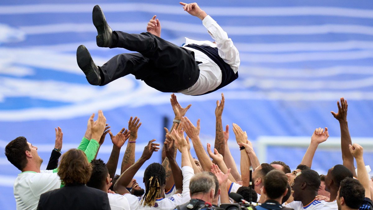 MADRID, SPAIN - APRIL 30: Head coach Carlo Ancelotti of Real Madrid is thrown in the air after the LaLiga Santander match between Real Madrid CF and RCD Espanyol at Estadio Santiago Bernabeu on April 30, 2022 in Madrid, Spain. (Photo by Angel Martinez/Getty Images)