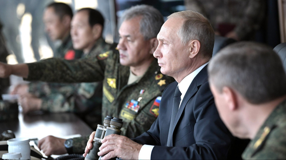 TRANSBAIKAL TERRITORY, RUSSIA - SEPTEMBER 13 : (----EDITORIAL USE ONLY  MANDATORY CREDIT -  RUSSIAN PRESIDENTIAL PRESS AND INFORMATION OFFICE / HANDOUT - NO MARKETING NO ADVERTISING CAMPAIGNS - DISTRIBUTED AS A SERVICE TO CLIENTS----) Russias Defence Minister Sergei Shoigu (L), Russias President Vladimir Putin (C) and Valery Gerasimov (R) , Russias First Deputy Defence Minister and Chief of the General Staff of the Russian Armed Forces observe the main stage of the Vostok 2018 military exercises held jointly by the Russian Armed Forces and the Chinese Peoples Liberation Army at the Tsugol range in Transbaikal Territory, Russia on September 13, 2018. in Transbaikal Territory, Russia on September 13, 2018. (Photo by Russian Presidential Press and Information Office / Handout/Anadolu Agency/Getty Images)