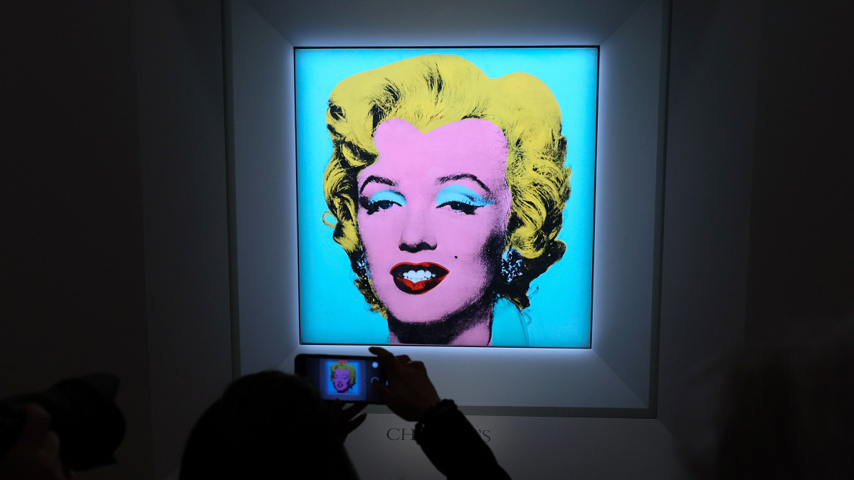 NEW YORK, NEW YORK - MARCH 21: A guest takes a photo during Christies announcement that they will offer Andy Warholâs Shot Sage Blue Marilyn painting of Marilyn Monroe at Christieâs on March 21, 2022 in New York City. The work comes to Christieâs from the Thomas and Doris Ammann Foundation Zurich and all proceeds of the sale will benefit the foundation. (Photo by Dia Dipasupil/Getty Images)