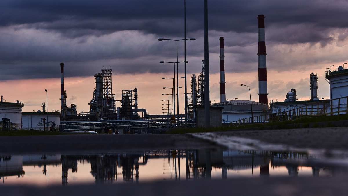 Refining towers and silos stand at the Grupa Lotos SA oil refinery at dusk in Gdansk, Poland, on Tuesday, July 28, 2020. Polish refiner PKN Orlen won conditional European Union approval to buy rival Lotos after agreeing on a extensive commitments package designed to allay potential competition concerns. Photographer: Bartek Sadowski/Bloomberg via Getty Images
