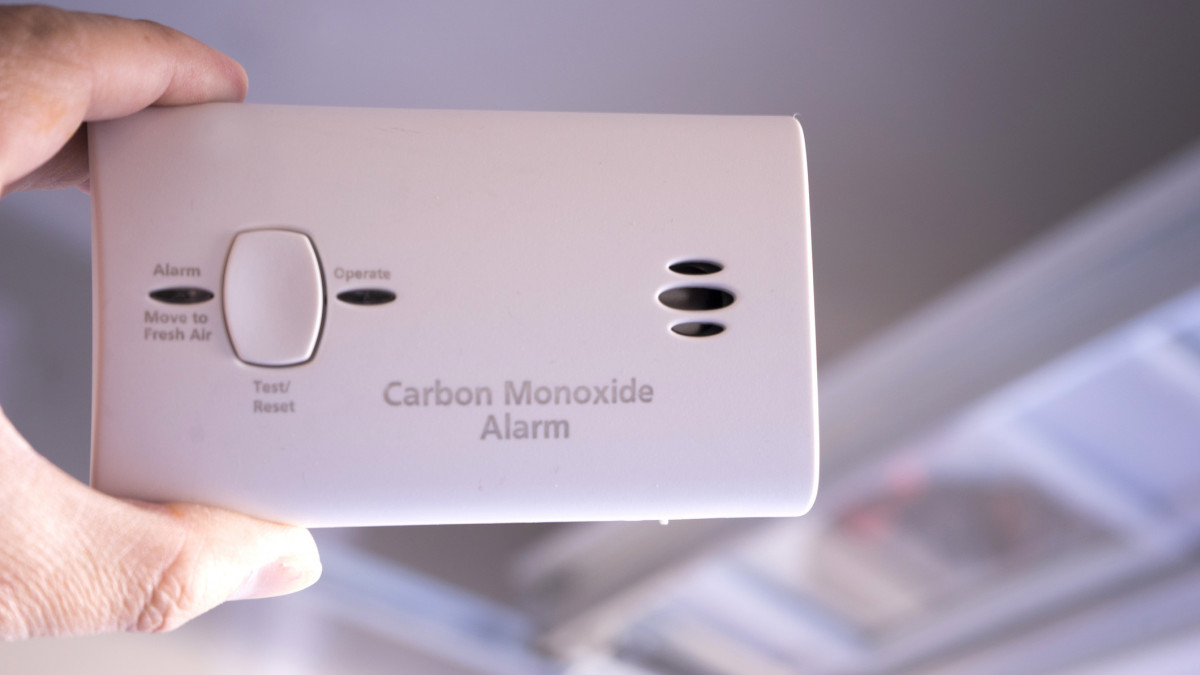 close up shot of carbon monoxide alarm near garage