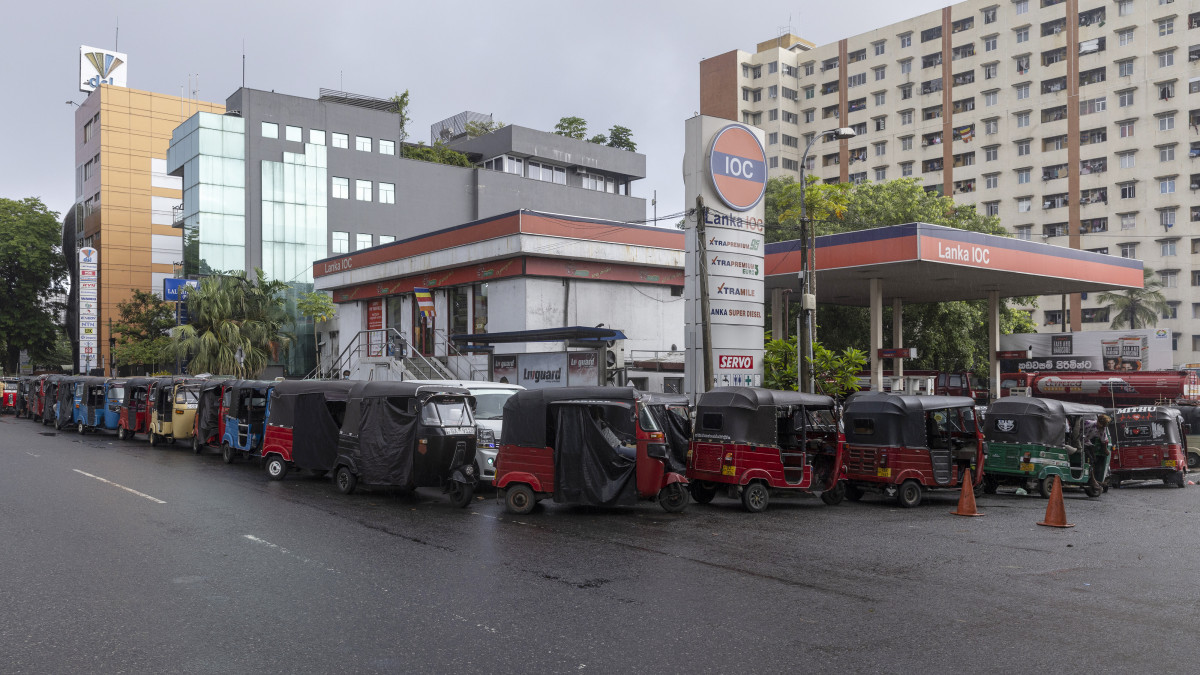 Three-wheelers line up for fuel at a gas station in Colombo, Sri Lanka, on Monday, May 16, 2022. Sri Lanka has been rattled by power cuts, food shortages, and a currency in free fall, which fueled protests and pushed Prime MinisterÂ Mahinda Rajapaksa to resign. Photographer: Buddhika Weerasinghe/Bloomberg via Getty Images