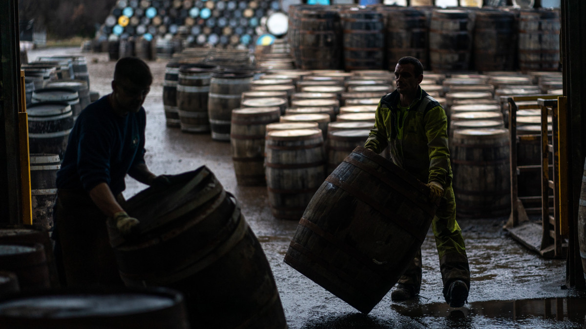 CRAIGELLACHIE, SCOTLAND - JANUARY 19: Workers are seen moving whisky casks at Speyside Cooperage on January 19, 2022 in Craigellachie, Scotland. Scotch whisky producers are still grappling with the impact of Brexit on their exports to EU countries, and Covid-19 travel restrictions have hampered tourism at distilleries. (Photo by Peter Summers/Getty Images)