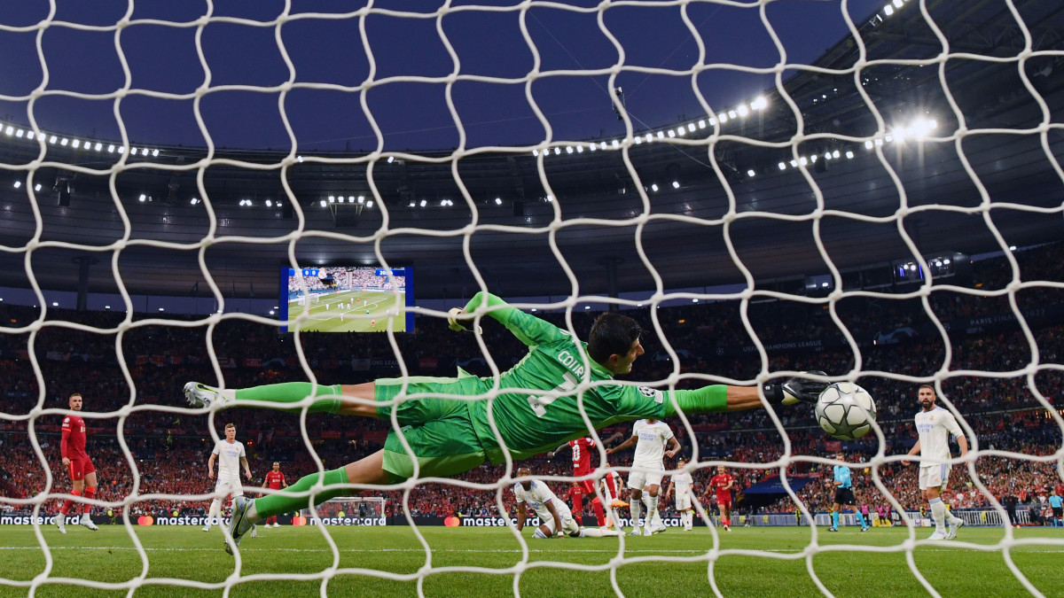 PARIS, FRANCE - MAY 28: Sadio Mane of Liverpool has a shot saved by Thibaut Courtois of Real Madrid during the UEFA Champions League final match between Liverpool FC and Real Madrid at Stade de France on May 28, 2022 in Paris, France. (Photo by Shaun Botterill/Getty Images)