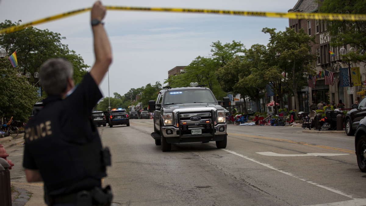 HIGHLAND PARK, IL - JULY 04: First responders work the scene of a shooting at a Fourth of July parade on July 4, 2022 in Highland Park, Illinois. Reports indicate at least five people were killed and 19 injured in the mass shooting. (Photo by Jim Vondruska/Getty Images)