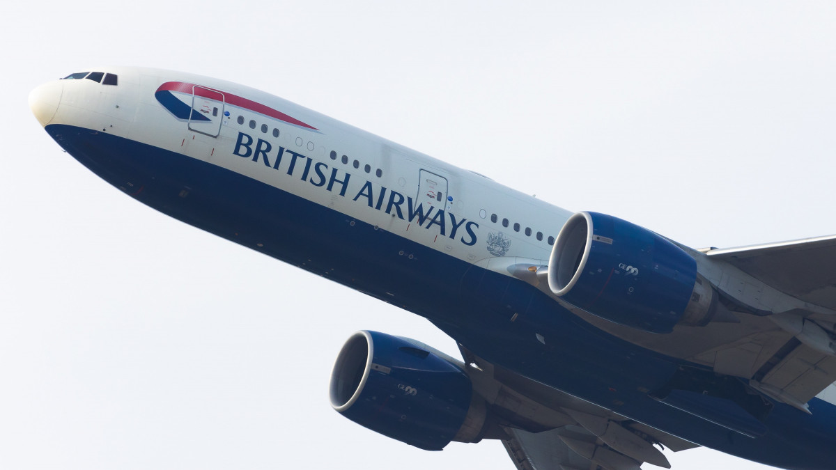 LONDON, UNITED KINGDOM - 2022/06/26: A British Airways Boeing 777 is seen taking off from London Heathrow Airport. Hundreds of the flag carriers ground staff have voted to strike next month over a 10% pay cut imposed during the coronavirus pandemic. (Photo by Tejas Sandhu/SOPA Images/LightRocket via Getty Images)