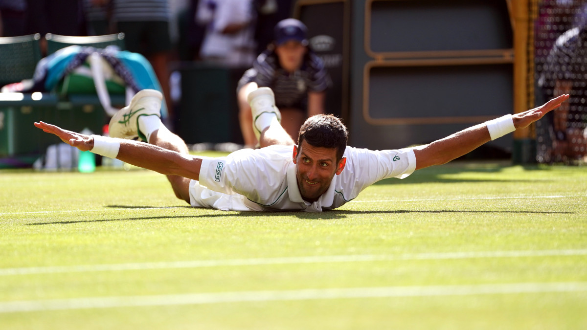 Novak Djokovic celebrates victory over Nick Kyrgios in The Final of the Gentlemens Singles on day fourteen of the 2022 Wimbledon Championships at the All England Lawn Tennis and Croquet Club, Wimbledon. Picture date: Sunday July 10, 2022. (Photo by Adam Davy/PA Images via Getty Images)