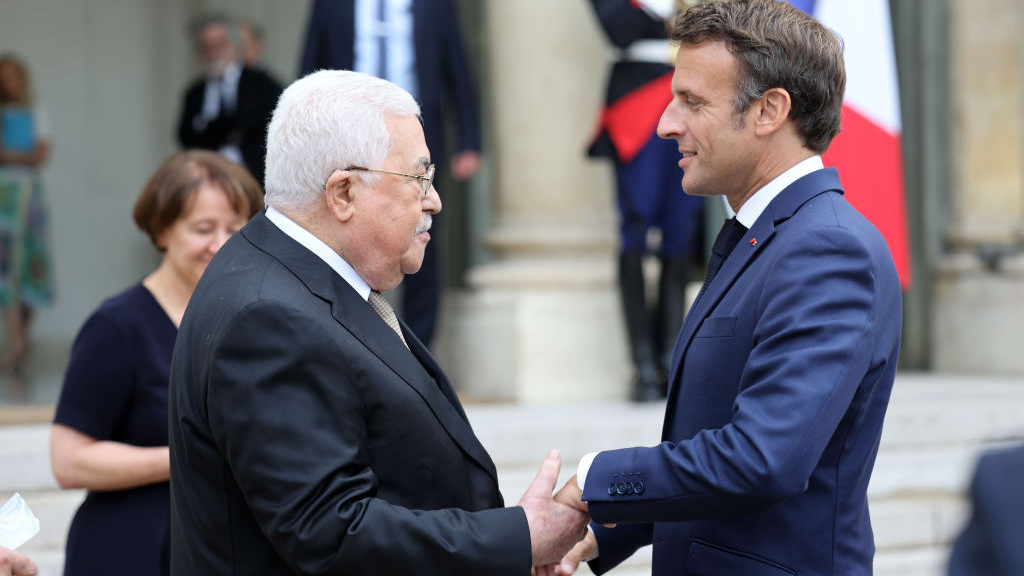 PARIS, FRANCE - JULY 20: (----EDITORIAL USE ONLY Ă˘ MANDATORY CREDIT - PALESTINIAN PRESIDENCY / HANDOUT - NO MARKETING NO ADVERTISING CAMPAIGNS - DISTRIBUTED AS A SERVICE TO CLIENTS----) French President Emmanuel Macron (R) welcomes Palestinian President Mahmoud Abbas (L) at the Elysee Palace in Paris, France on July 20, 2022. (Photo by Palestinian Presidency/Handout/Anadolu Agency via Getty Images)