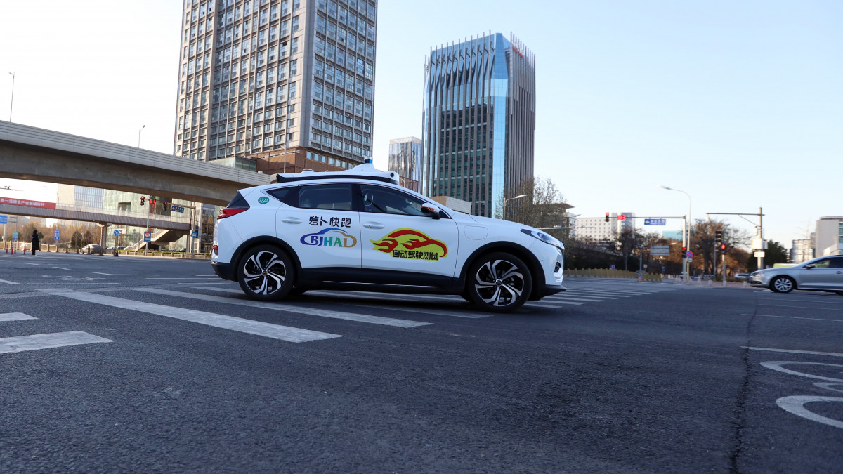 BEIJING, CHINA - NOVEMBER 26: A Baidu Apollo Gos commercialized autonomous robotaxi runs along a road after Beijing launched Chinas first-ever demonstration zone for commercial self-driving in the Beijing Economic and Technological Development Zone on November 26, 2021 in Beijing, China. (Photo by VCG/VCG via Getty Images)
