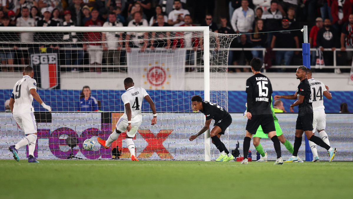 HELSINKI, FINLAND - AUGUST 10: Tuta of Eintracht Frankfurt looks on as David Alaba of Real Madrid scores their sides first goal during the UEFA Super Cup Final 2022 between Real Madrid CF and Eintracht Frankfurt at Helsinki Olympic Stadium on August 10, 2022 in Helsinki, Finland. (Photo by Alex Grimm/Getty Images )