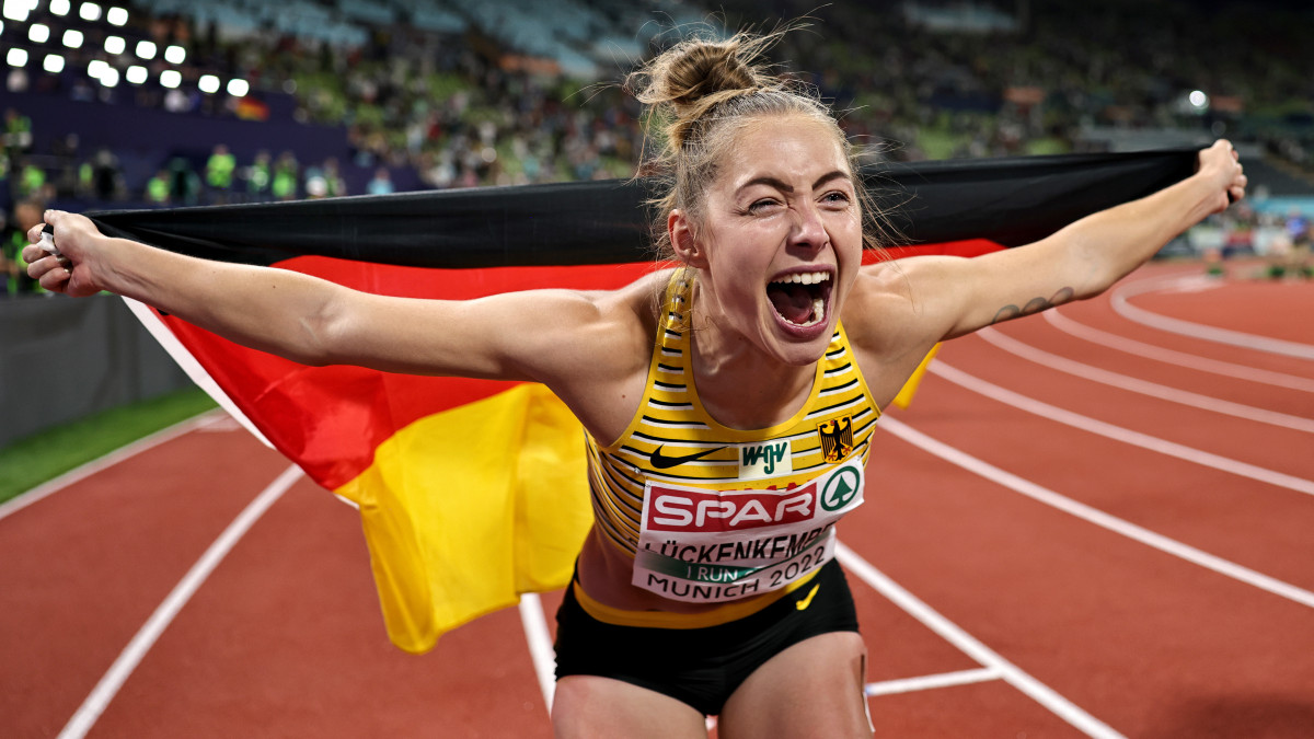 MUNICH, GERMANY - AUGUST 16: Gold medalist Gina Luckenkemper of Germany celebrates after the Athletics - Womens 100m Final on day 6 of the European Championships Munich 2022 at Olympiapark on August 16, 2022 in Munich, Germany. (Photo by Simon Hofmann/Getty Images for European Athletics)