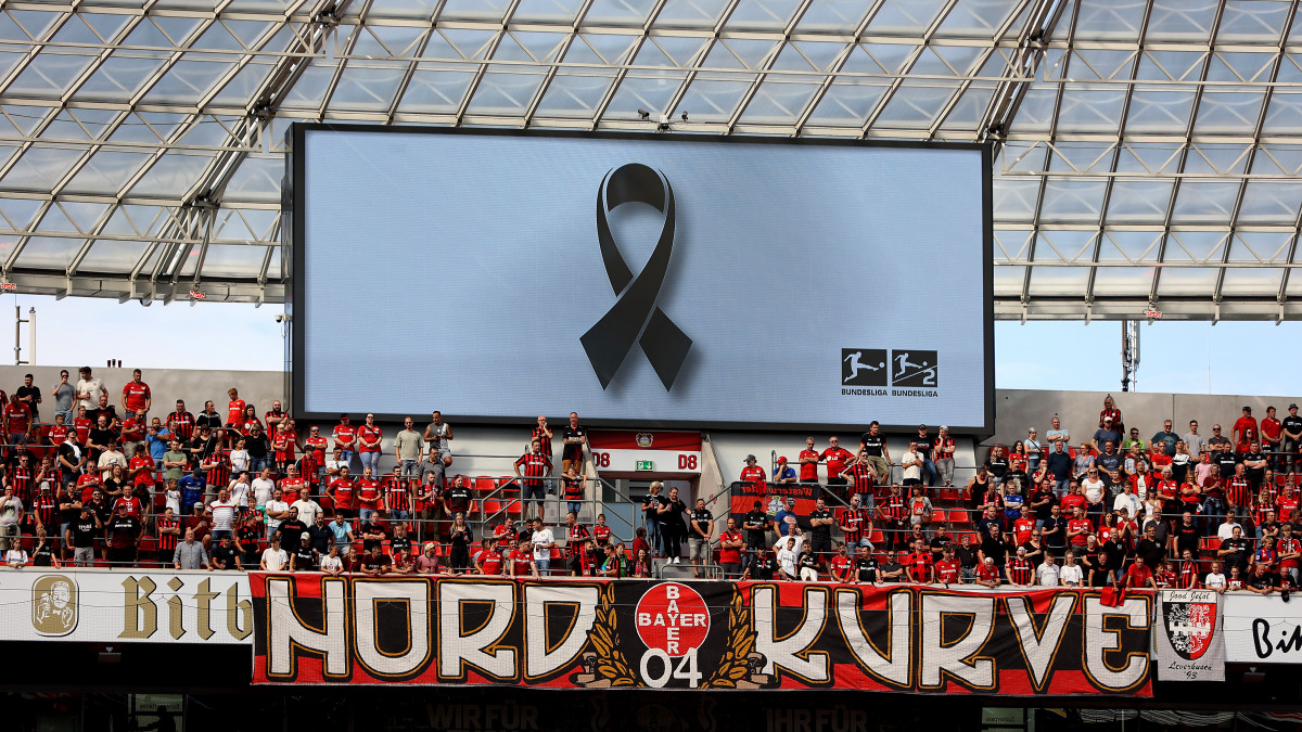 LEVERKUSEN, GERMANY - SEPTEMBER 03: An LED screen inside the stadium shows a banner to remember the Munich massacre attack during the 1972 Munich Summer Olympics prior to kick-off in the Bundesliga match between Bayer 04 Leverkusen and Sport-Club Freiburg at BayArena on September 03, 2022 in Leverkusen, Germany. (Photo by Christof Koepsel/Getty Images)