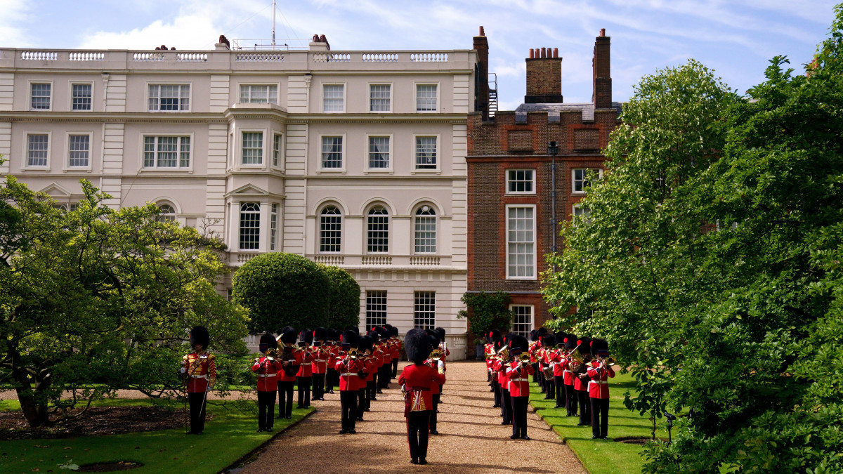 LONDON, ENGLAND - JULY 6: The Band of the Coldstream Guards play Three Lions and Sweet Caroline in the gardens of Clarence House ahead of Englands Euro 2020 semi-final game against Denmark on July 6, 2021 in in London, England. In support to the England Football Team as they approach their Semi-Final match in the UEFA Euro Championships on Wednesday evening The Prince of Wales and The Duchess of Cornwall invited the Band of the Coldstream Guards into the Clarence House Garden to play the following pieces: Three Lions â Composed by Ian Broudie, arranged by Oliver Jeans and Sweet Caroline â Composed by Neil Diamond, arranged by Tim Waters.  (Photo by Victoria Jones-WPA Pool/Getty Images)