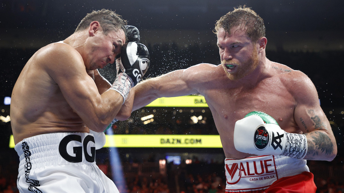 LAS VEGAS, NEVADA - SEPTEMBER 17: Canelo Alvarez (red trunks) lands a punch against Gennadiy Golovkin (white trunks) in round twelve of the fight for the Super Middleweight Title at T-Mobile Arena on September 17, 2022 in Las Vegas, Nevada. (Photo by Sarah Stier/Getty Images)