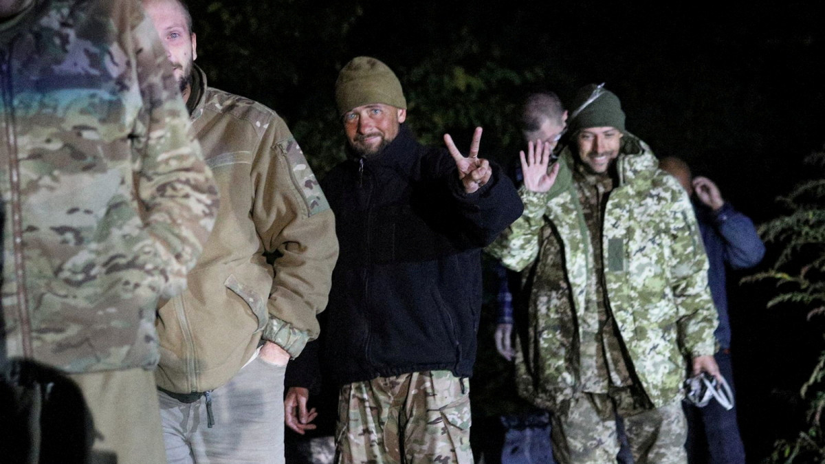 Ukrainian prisoners of war (POWs) smile after a swap, amid Russias attack on Ukraine, in Chernihiv region, Ukraine, in this handout picture released September 22, 2022. Press Service of the State Security Service of Ukraine/Handout via REUTERS ATTENTION EDITORS - THIS IMAGE HAS BEEN SUPPLIED BY A THIRD PARTY. DO NOT OBSCURE LOGO.      TPX IMAGES OF THE DAY