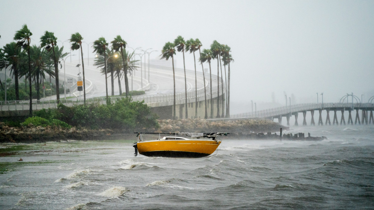 SARASOTA, FL - SEPTEMBER 28: A sail boat is beached  at Sarasota Bay as Hurricane Ian approaches on September 28, 2022 in Sarasota, Florida. Forecasts call for the storm to make landfall in the area on Wednesday as a likely Category 4 hurricane. (Photo by Sean Rayford/Getty Images)