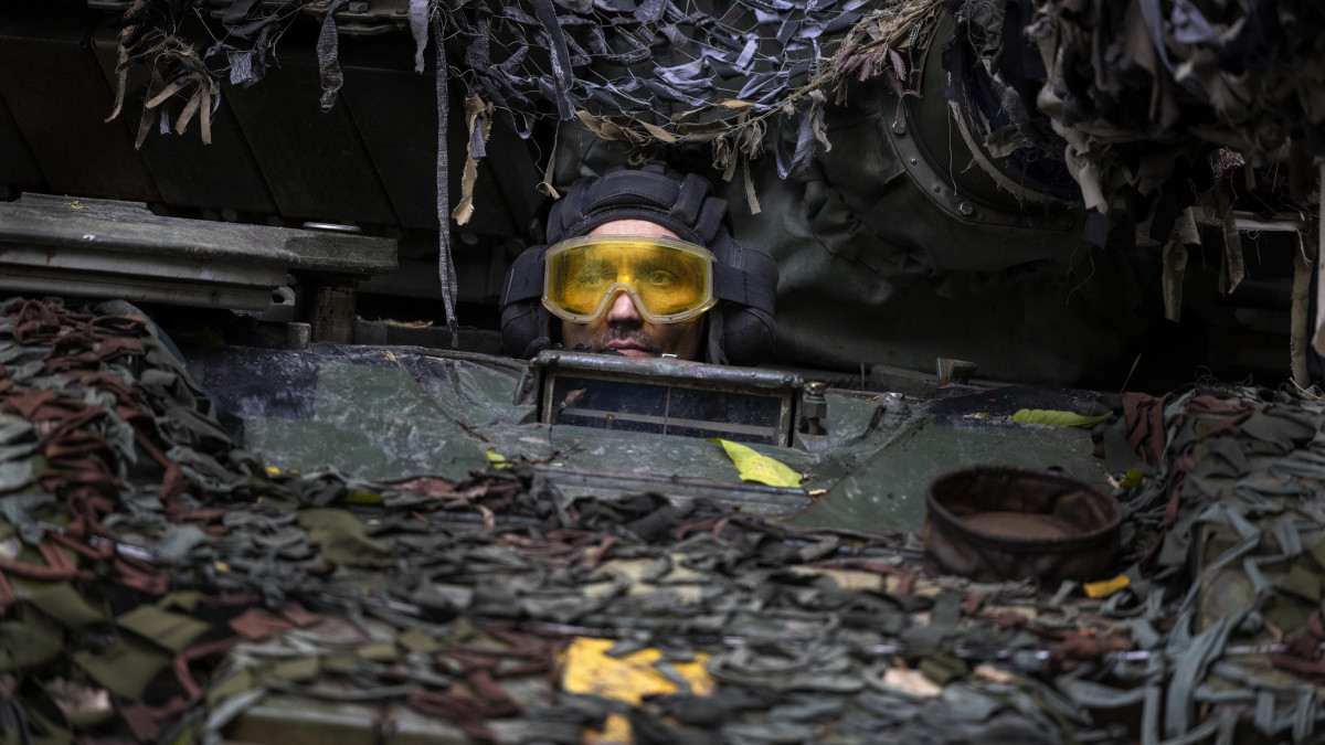 KHARKIV, UKRAINE - A Ukrainian mechanic test drives a repaired Russian tank in a wooded area outside the city on September 26 2022 in Kharkiv, Ukraine. Mechanics are repairing captured Russian tanks that were damaged in battle, so that they can be used by the Ukrainian military against their enemy. (Photo by Paula Bronstein /Getty Images)