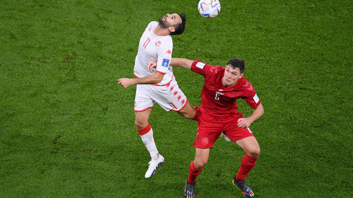 AL RAYYAN, QATAR - NOVEMBER 22: Taha Yassine Khenissi of Tunisia jumps for the ball with Andreas Christensen of Denmark during the FIFA World Cup Qatar 2022 Group D match between Denmark and Tunisia at Education City Stadium on November 22, 2022 in Al Rayyan, Qatar. (Photo by Laurence Griffiths/Getty Images)