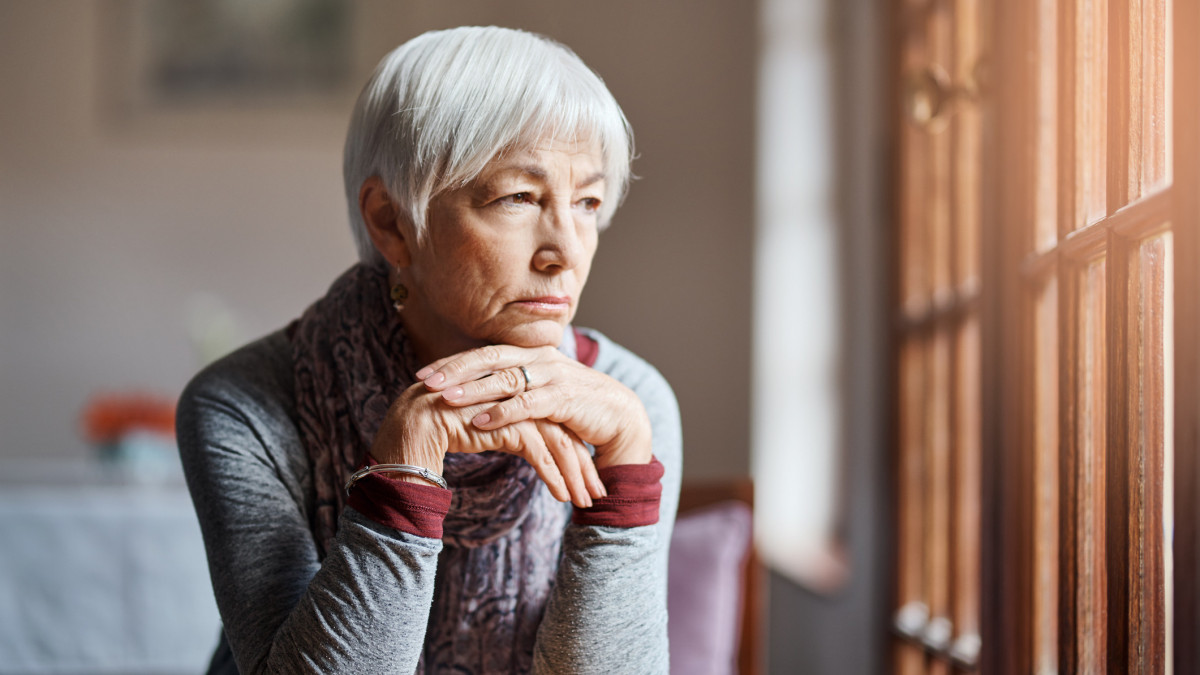 Shot of a senior woman looking thoughtful in a retirement home