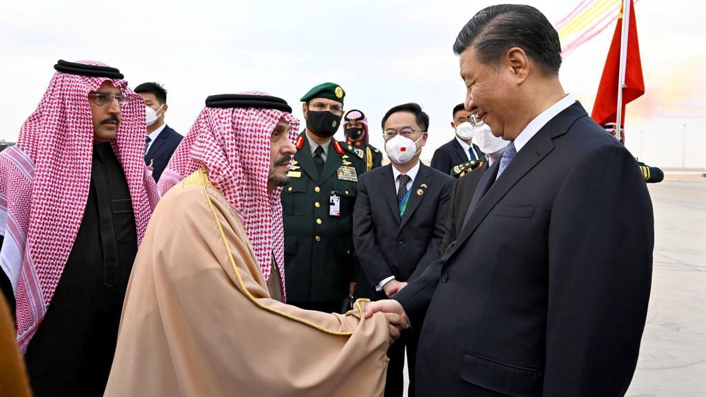 RIYADH, SAUDI ARABIA - DECEMBER 07: (----EDITORIAL USE ONLY Ă˘ MANDATORY CREDIT - SAUDI ARABIAN FOREIGN MINISTRY / HANDOUT - NO MARKETING NO ADVERTISING CAMPAIGNS - DISTRIBUTED AS A SERVICE TO CLIENTS----) President of the Peoples Republic of China Xi Jinping (R) is welcomed by Emir of Riyadh Faisal bin Bende bin Abdulaziz (L) and Saudi Arabian Foreign Minister Faisal bin Farhan (not seen) at King Khalid International Airport in Riyadh, Saudi Arabia on December 07, 2022. (Photo by Saudi Arabian Foreign Ministry / Handout/Anadolu Agency via Getty Images)