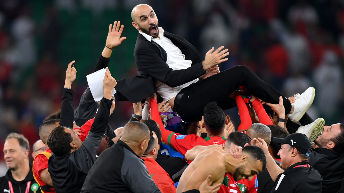 DOHA, QATAR - DECEMBER 10: Walid Regragui, Head Coach of Morocco, celebrates with their team after the teams victory during the FIFA World Cup Qatar 2022 quarter final match between Morocco and Portugal at Al Thumama Stadium on December 10, 2022 in Doha, Qatar. (Photo by Justin Setterfield/Getty Images)