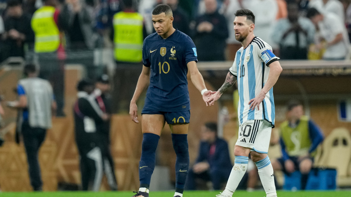 LUSAIL CITY, QATAR - DECEMBER 18: Kylian Mbappe of France and Lionel Messi of Argentina shake hands during the FIFA World Cup Qatar 2022 Final match between Argentina and France at Lusail Stadium on December 18, 2022 in Lusail City, Qatar. (Photo by Mohammad Karamali/Defodi Images via Getty Images)