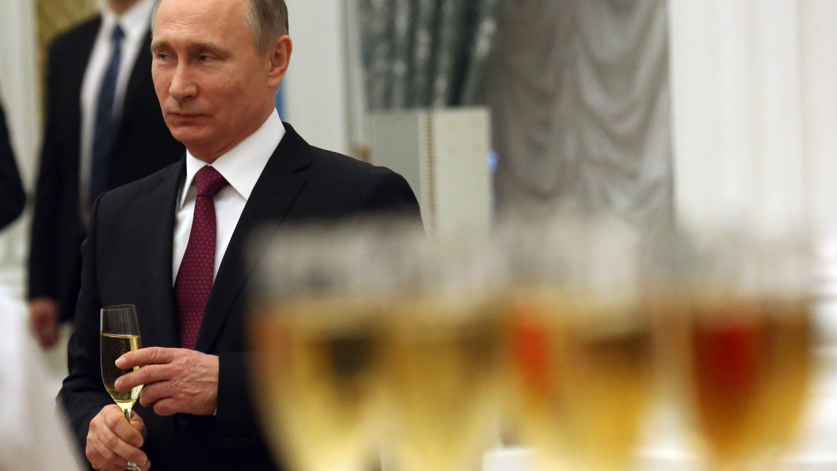 MOSCOW, RUSSIA - DECEMBER,10: Russian President Vladimir Putin holds a glass of champaigne  during awarding ceremony at the Kremlin on December 10, 2015 in Moscow, Russia. Putin awarded four dozens people, including actors, scientists, businessmen and workers, during the ceremony on Thursday.  (Photo by Sasha Mordovets/Getty Images)