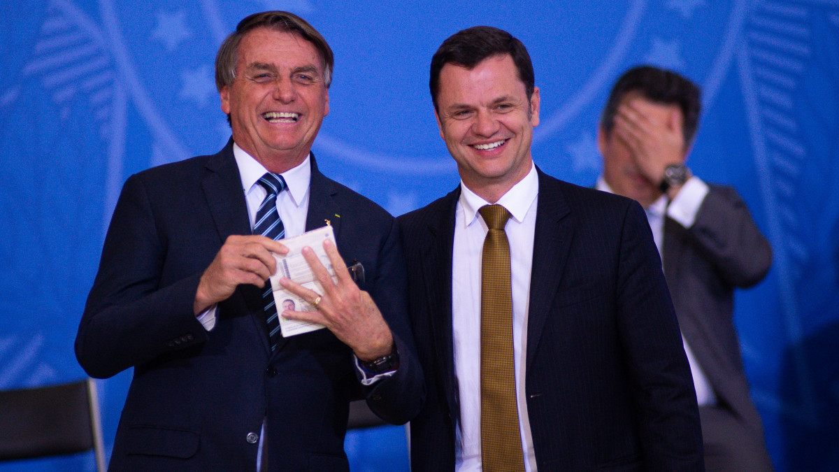 BRASILIA, BRAZIL - JUNE 27: Justice Minister Anderson Gustavo Torres hands over a new passport toÂ President of Brazil Jair Bolsonaro duringÂ the ceremony to unveil a project for new national IDs and passports at Planalto Palace on June 27, 2022 in Brasilia, Brazil.  (Photo by Andressa Anholete/Getty Images)
