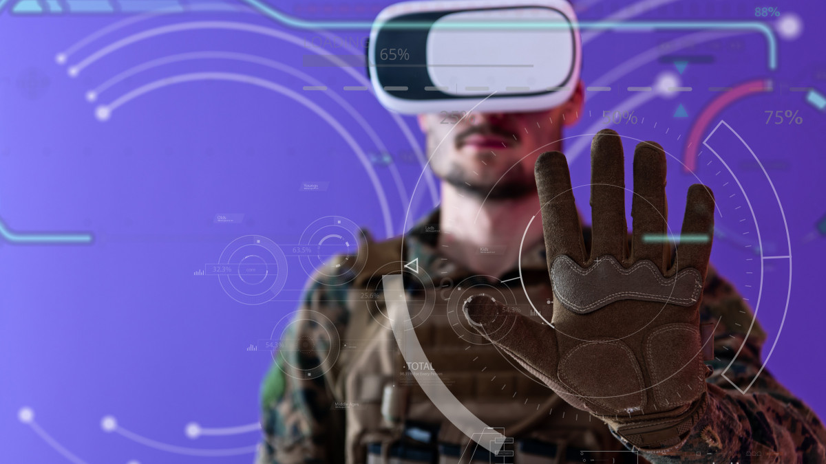modern warfare futuristic soldier using vr virtual reality glasses on purple backgroun  as concept of artificial intelience on hud screen display