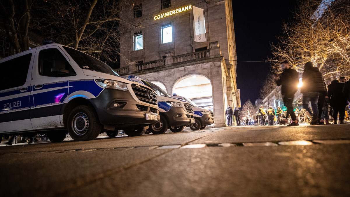 01 January 2023, Baden-Wuerttemberg, Stuttgart: Police patrol cars are on standby at Schlossplatz. On New Years Eve, fireworks are banned in Stuttgarts city ring - The city has organized a New Years Eve party on the cordoned-off Schlossplatz. There are controls at the entrances to the celebration area, since according to the organizers firecrackers and glass are not allowed for safety reasons - The police will provide security. Photo: Christoph Schmidt/dpa (Photo by Christoph Schmidt/picture alliance via Getty Images)