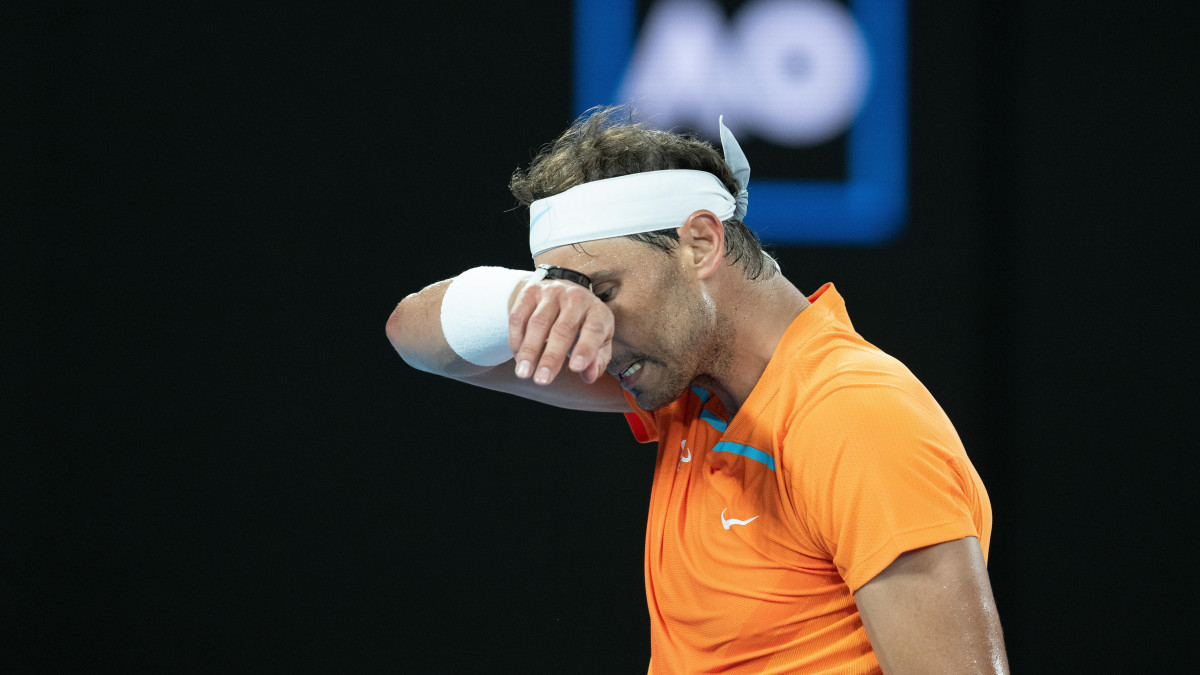 MELBOURNE, AUSTRALIA - JANUARY 18: Rafael Nadal of Spain reacts in their round two singles match against Mackenzie McDonald of the United States during day three of the 2023 Australian Open at Melbourne Park on January 18, 2023 in Melbourne, Australia. (Photo by Will Murray/Getty Images)