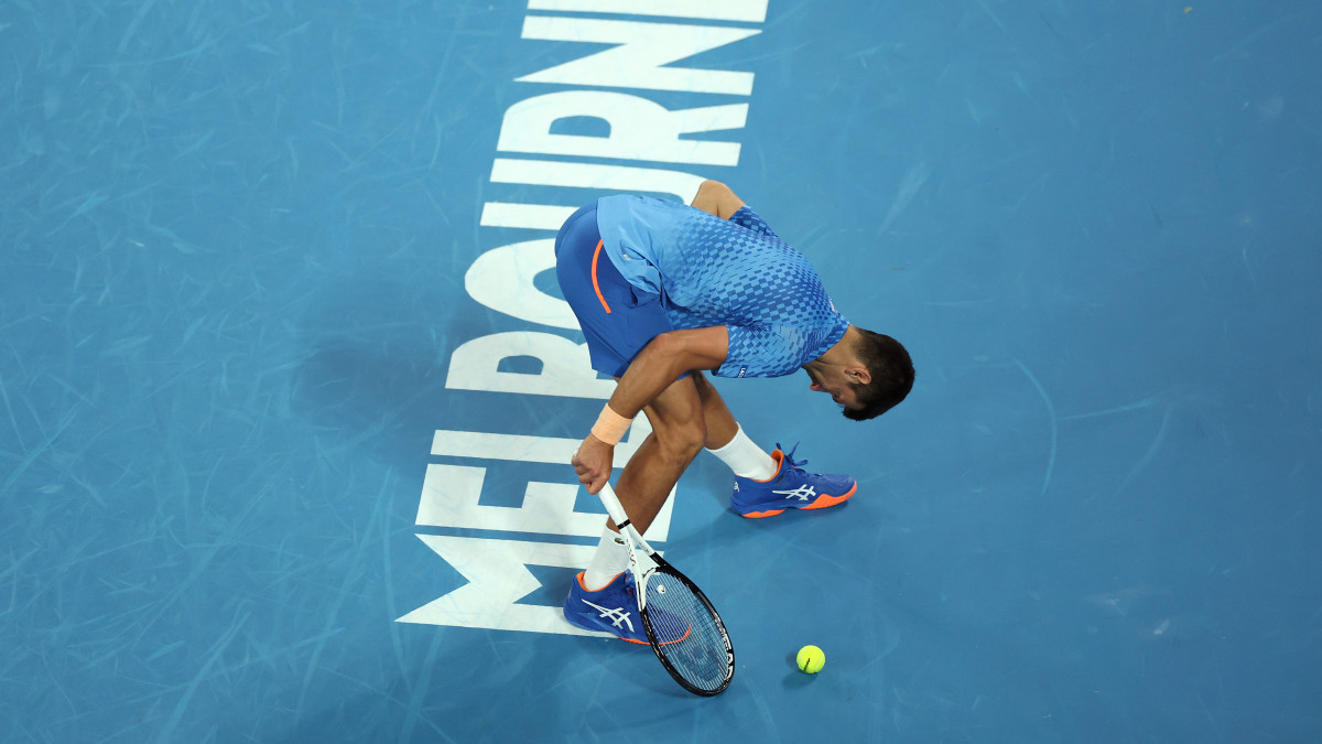MELBOURNE, AUSTRALIA - JANUARY 21: Novak Djokovic of Serbia stretches during the third round singles match against Grigor Dimitrov of Bulgaria during day six of the 2023 Australian Open at Melbourne Park on January 21, 2023 in Melbourne, Australia. (Photo by Mackenzie Sweetnam/Getty Images)