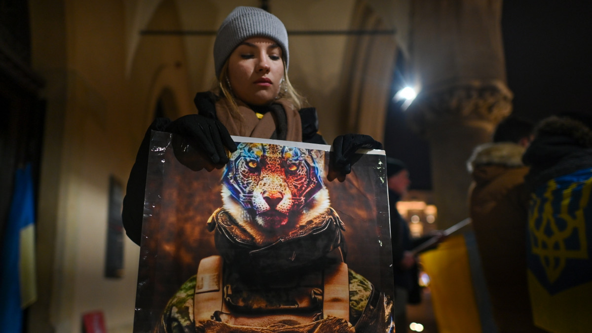 Ukrainian activist holds a poster with words Free The Leopards during the Protest in Support of Ukraine on the Main Market Square in Krakow, on the 341th day of the Russian invasion of Ukraine.On Monday, January 30, 2023, in Krakow, Lesser Poland Voivodeship, Poland. (Photo by Artur Widak/NurPhoto via Getty Images)