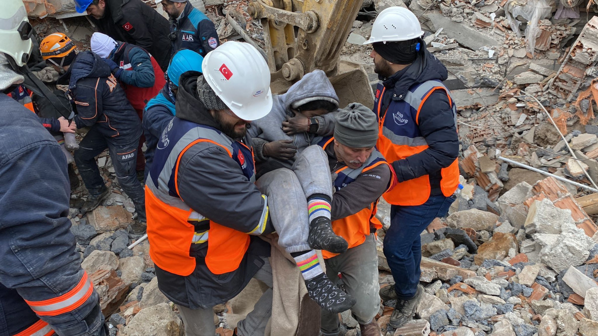 MALATYA, TURKIYE - FEBRUARY 07: 2 girls are rescued from the rubble after 34 hours of 7.7 magnitude Kahramanmaras earthquake hits Hatay, Turkiye on February 7, 2023. Early Monday morning, a strong 7.7 earthquake, centered in the Pazarcik district, jolted Kahramanmaras and strongly shook several provinces, including Gaziantep, Sanliurfa, Diyarbakir, Adana, Adiyaman, Malatya, Osmaniye, Hatay, and Kilis. Later, at 13.24 p.m. (1024GMT), a 7.6 magnitude quake centered in Kahramanmaras Elbistan district struck the region. Turkiye declared 7 days of national mourning after deadly earthquakes in southern provinces. (Photo by Kadir Aydin/Anadolu Agency via Getty Images)
