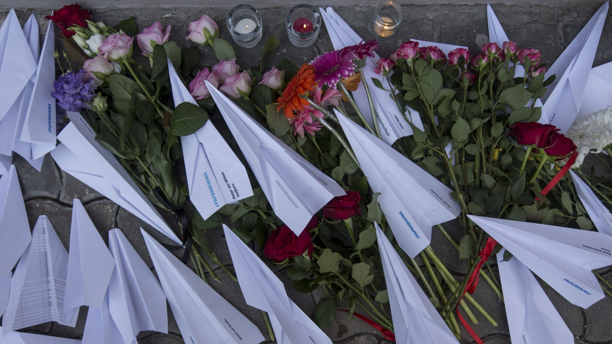 MOSCOW, RUSSIA - JULY 17:  Flowers and paper planes are left during a commemorative event for the victims who died in the crash of Malaysian Airlines flight MH17, in front of the Embassy of the Netherlands in Moscow on July 17, 2015. All 298 passengers and crew died on July 17,2014 when the Malaysia Airlines Boeing 777, on a flight between Amsterdam and Kuala Lumpur, was shot down over rebel-held east Ukraine. (Photo by  Nikita Shvetsov/Anadolu Agency/Getty Images)