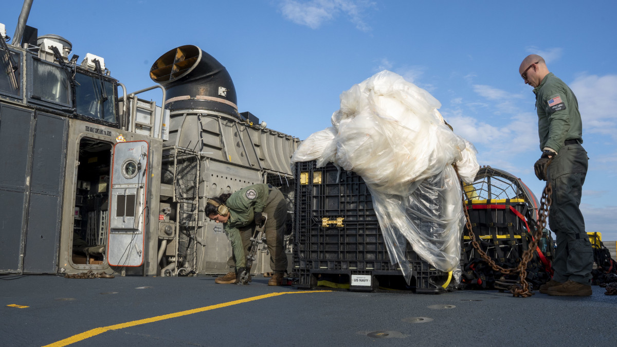 VIRGINIA BEACH, VA - FEBRUARY 10: In this U.S. Navy handout, Sailors assigned to Assault Craft Unit 4 prepare material recovered in the Atlantic Ocean from a high-altitude balloon for transport to federal agents at Joint Expeditionary Base Little Creek Feb. 10, 2023. At the direction of the President of the United States and with the full support of the Government of Canada, U.S. fighter aircraft under U.S. Northern Command authority engaged and brought down a high-altitude balloon within sovereign U.S. airspace and over U.S. territorial waters, Feb.4, 2023. Active duty, reserve, National Guard, and civilian personnel planned and executed the operation, and partners from the U.S. Coast Guard, Federal Aviation Administration, Federal Bureau of Investigation, and Naval Criminal Investigative Service (NCIS) ensured public safety throughout the operation and recovery efforts. (Photo by Ryan Seelbach/U.S. Navy via Getty Images)