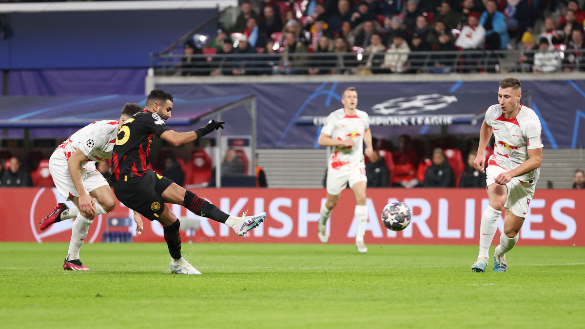 LEIPZIG, GERMANY - FEBRUARY 22: Riyad Mahrez of Manchester City scores the teams first goal during the UEFA Champions League round of 16 leg one match between RB Leipzig and Manchester City at Red Bull Arena on February 22, 2023 in Leipzig, Germany. (Photo by Lars Baron/Getty Images)